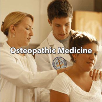 Doctor examining patient in exam room