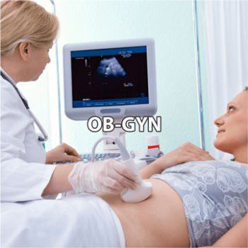 OBGYN performing ultrasound on woman in exam room